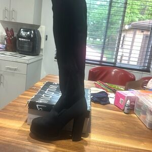Black knee high Swede heel